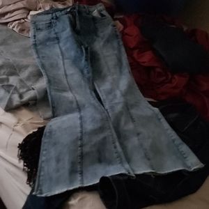 Wide leg jeans, fringed bottom . Runs very small